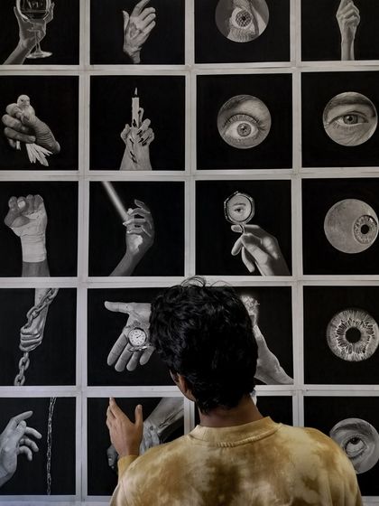 Pointing out a detail in one of the drawings. I spent anywhere from 8 to 14 hours on each of these pieces.