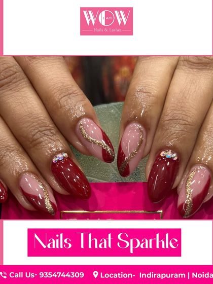 A sophisticated design in deep red, featuring sparkling gold glitter accents and delicate rhinestone details. This look is perfect for a special occasion.