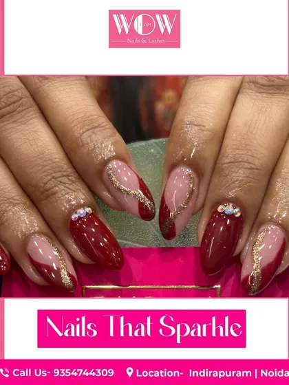 A sophisticated design in deep red, featuring sparkling gold glitter accents and delicate rhinestone details. This look is perfect for a special occasion.