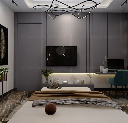 This view shows the other side of the Varanasi bedroom, which includes a long, built-in desk and TV unit, creating a functional workspace.