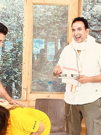 A moment of shared joy and respect between teachers and students during the certification ceremony in Rishikesh.