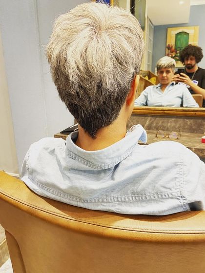 A view from the chair, showing the final shape of the V-nape on this pixie cut. It's these little details that make a haircut special.