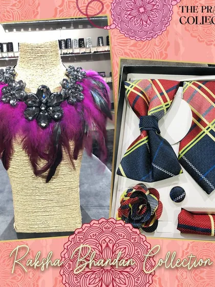 A bold and glamorous gift set. The men's accessories feature a red and yellow plaid pattern, while the women's statement collar is adorned with dramatic pink feathers and black crystal clusters.