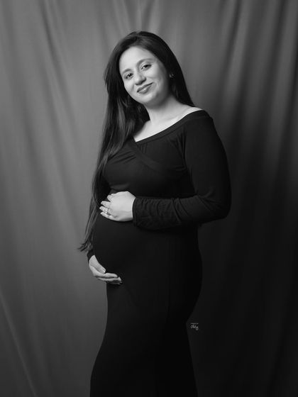 A confident and classic maternity pose. This black and white portrait is simple, elegant, and beautifully captures the essence of this special time.