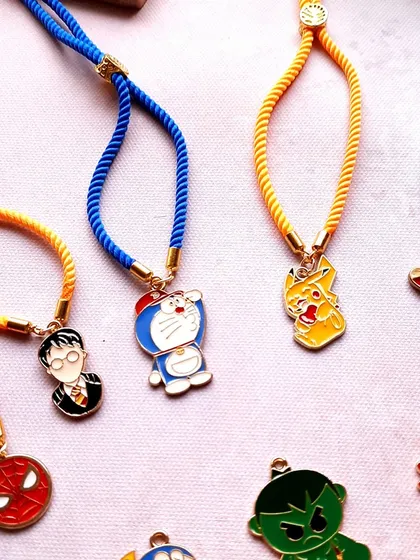 So many characters, so much fun. My kids' Rakhi collection features adjustable bands with charms like Doraemon, Harry Potter, Pikachu, and The Avengers. They are designed to be comfortable and super cute.