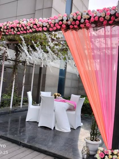 A small, intimate seating area at a poolside wedding. This space is perfect for guests to relax and chat away from the main ceremony.