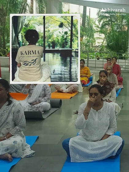 Participants in a workshop practicing Nadi Shuddhi, a preparatory breathing technique. This practice helps to purify the energy channels and calm the mind before moving into deeper asanas.