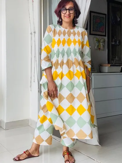 Showing off the flowy pants of the kurta set.
