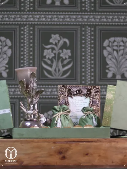 A wider view of the same green-themed hamper, presented on a tray. This is a celebration wrapped in elegance, perfect for weddings, anniversaries, or any grand occasion.