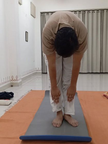 A full forward bend, showing the flexibility gained through consistent practice of Surya Kriya.
