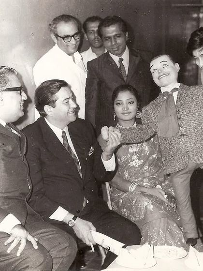 A classic black and white photo of my father with the iconic Raj Kapoor in the 1970s, after a performance at the Filmfare Awards.
