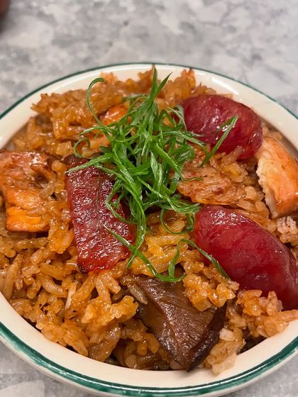 A comforting bowl of claypot chicken rice, a one pot meal that’s full of flavour. The rice is cooked with chicken, Chinese sausage, and mushrooms, absorbing all the delicious sauces. It’s topped with fresh spring onions for a bit of freshness.