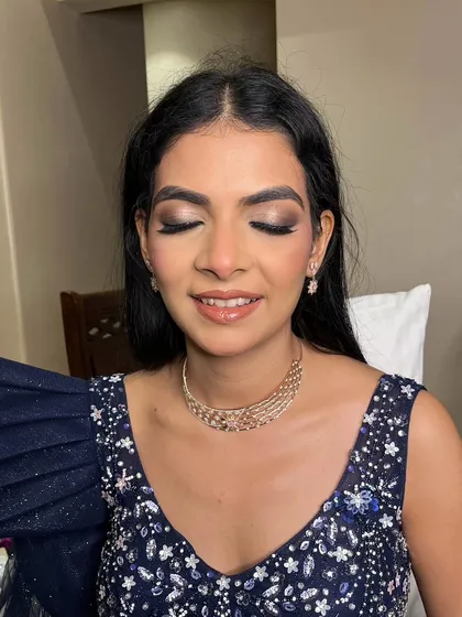 A detailed shot of the eye makeup for this reception look. The blend of dark and shimmering shadows creates depth and drama.