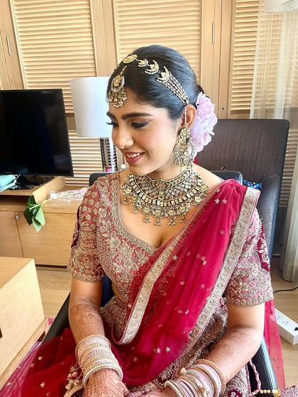 The bride's smile says it all. She looks happy and beautiful, ready for her ceremony.