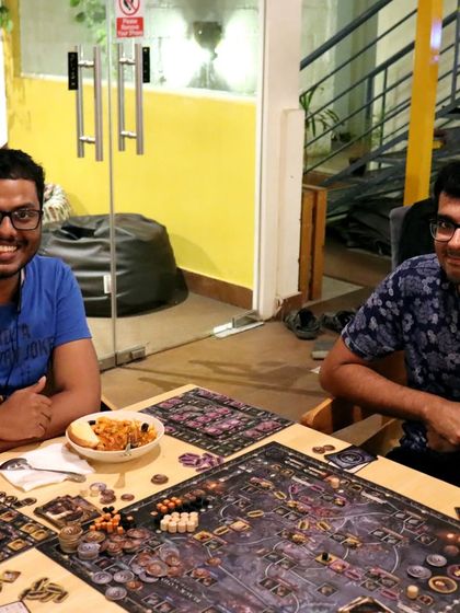 A game of 'Brass: Lancashire' accompanied by a delicious meal. Here, you can fuel your brain for a heavy strategy game with some homely food.