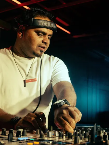 A close-up shot of me cueing up the next track. The Technics headphones are a classic for a reason. It's all about precision and timing.