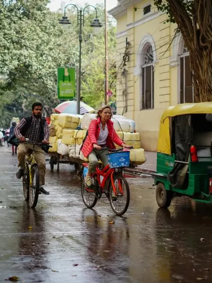A rider shares the road with local traffic, fully immersed in the daily life of the city. It's an authentic and exciting experience.