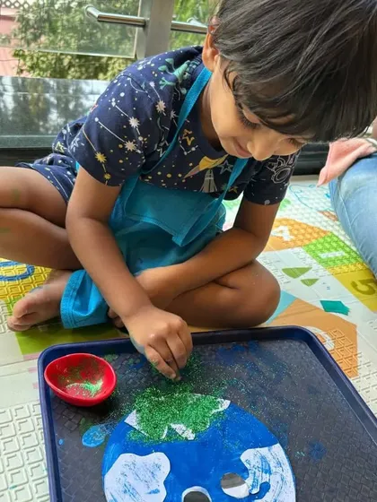 This Earth Day activity involved creating a planet with paint and then sprinkling on green glitter for the land. It’s a multi-step process that keeps children engaged.