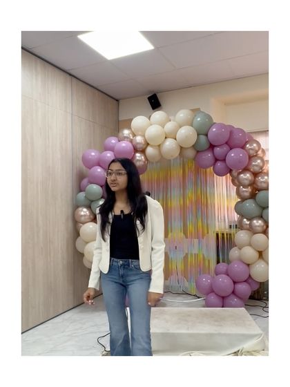 A student presents her speech with a calm and composed demeanor, showcasing her mastery over public speaking anxiety.