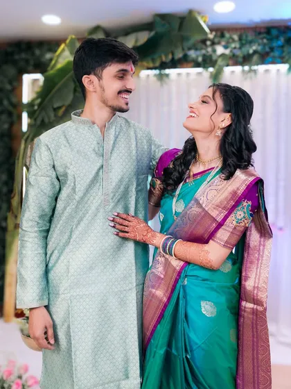A sweet, candid photo of a couple sharing a happy moment together.
