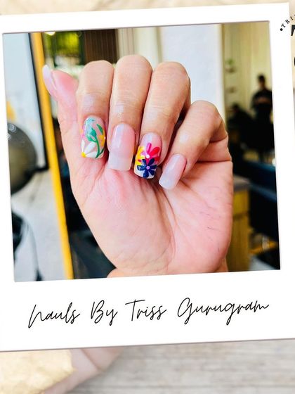 A clear shot of the finished floral nail art, showcasing the vibrant colors and intricate details of the hand-painted flowers. This custom design is a perfect way to express your personal style.