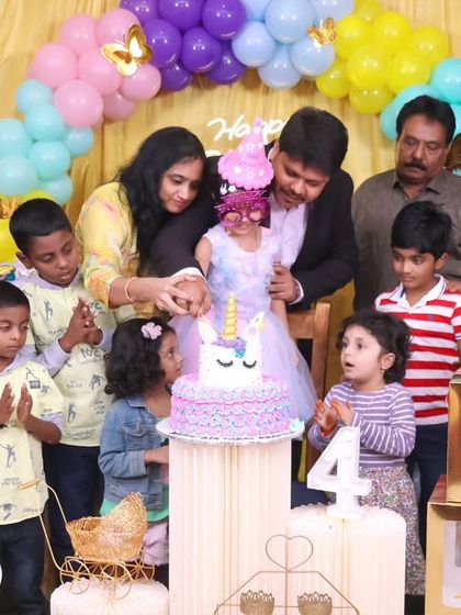 A charming 'Little Man' themed first birthday party, with a sophisticated black and white color scheme, mustache props, and a stylish backdrop, perfect for a dapper celebration.