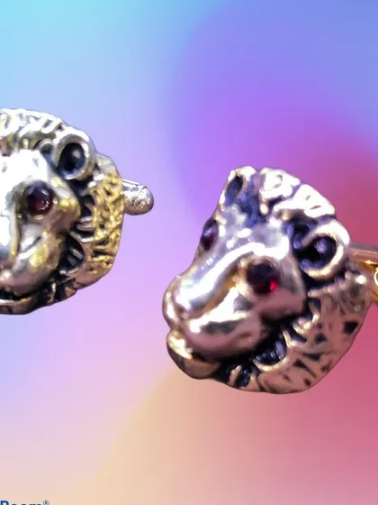 Make a bold statement with these 3D lion head cufflinks. Crafted in an antique gold finish with red crystal eyes, these pieces add a touch of power and regality to a formal shirt.