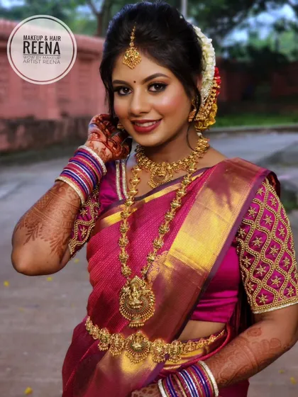 A classic South Indian bridal look for Remya. I created a bold eye, a deep red lip, and styled her hair in a traditional bun with fresh flowers.