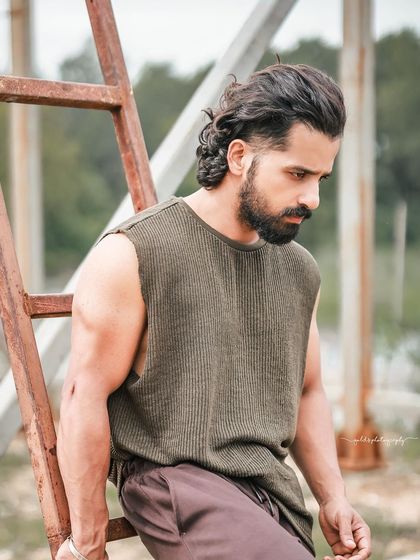 A series of portraits of actor Pruthvi Ambaar on location. These shots showcase a rugged, casual look against natural and industrial backdrops, highlighting his versatility.