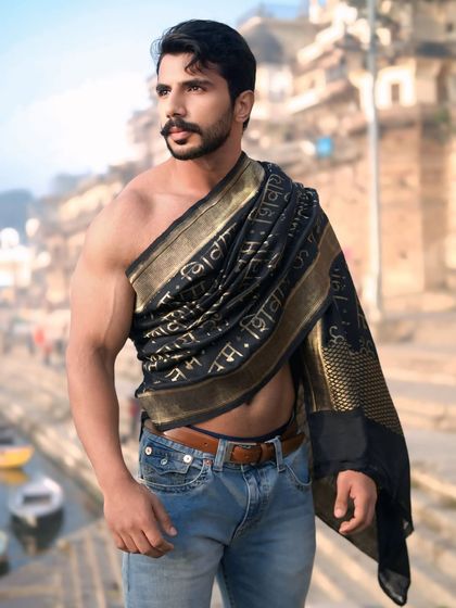 A confident and grounded portrait, showcasing a modern interpretation of traditional elements in the heart of ancient Varanasi.