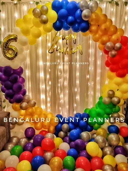 A vibrant, full circle rainbow balloon arch I constructed for a 6th birthday party. This colorful design makes for a fantastic photo backdrop and instantly brings a festive, joyful energy to the celebration.