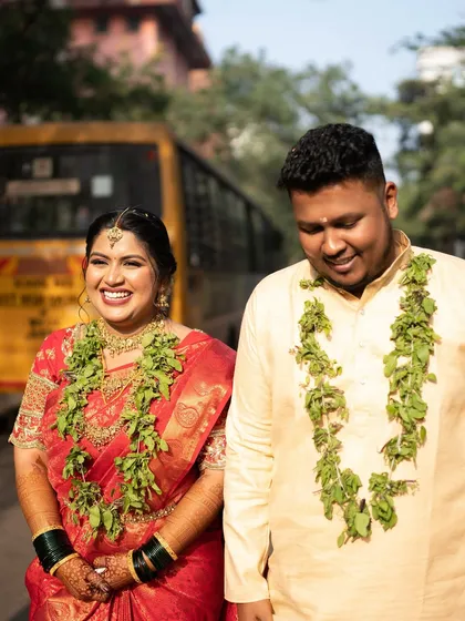 A fun and candid moment between the couple, their smiles telling a story of love and happiness.