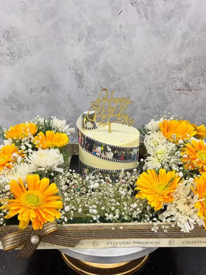 The complete picture of our Memory Reel Cake and floral tray. This is one of our favorite ways to help you celebrate birthdays and anniversaries in a grand, personal way.