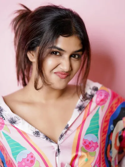 A playful and cute expression from a studio shoot, showing a different side of the model's personality.