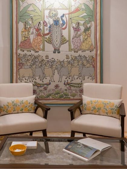 In our collaboration with Gaurang Home, these custom lounge chairs feature curvilinear forms and rattan handrests, paired with vibrant, nature-inspired textiles. This seating arrangement creates a living space that is rooted, personalized, and effortlessly sophisticated.