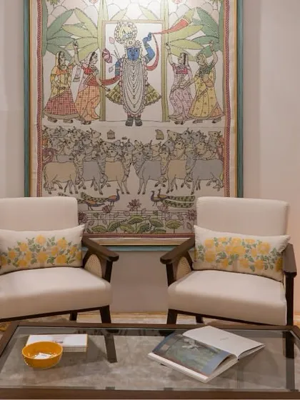 In our collaboration with Gaurang Home, these custom lounge chairs feature curvilinear forms and rattan handrests, paired with vibrant, nature-inspired textiles. This seating arrangement creates a living space that is rooted, personalized, and effortlessly sophisticated.