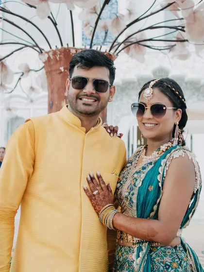 The happy couple at their Bhaat ceremony. Their smiles reflect a day filled with love, tradition, and beautiful surroundings.