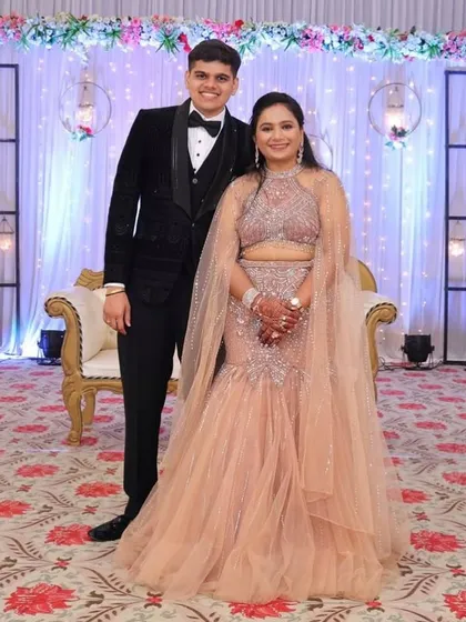 You can never go wrong with a classic. Here's my sharp black velvet tuxedo, the ultimate choice for a formal reception or black-tie event. Paired with a stunning gown, it creates a timeless and elegant couple look.