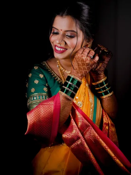 A close-up of the bride getting ready, showing the final touches to her traditional look.