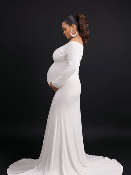 A side profile is perfect for emphasizing the baby bump. This classic pose is a must-have in any maternity gallery.