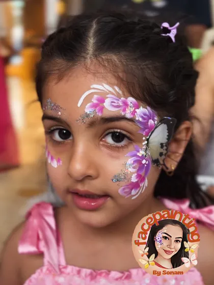 A lovely purple butterfly design on a happy little girl. The glitter adds that perfect touch of magic.