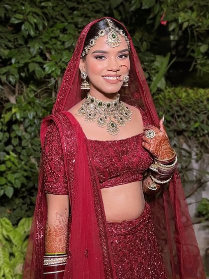 The complete look, with the dupatta perfectly draped to frame her smiling face. This is the classic, radiant Indian bride look that I love to create.