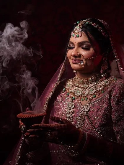 A variation of the smoke portrait, this image captures a different angle and expression, adding to the collection of artistic bridal shots.