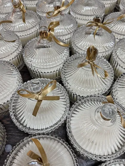Another angle of our beautiful crystal jar candles, a favorite for wedding favors. The intricate glass design and delicate ribbon make them a truly special gift for guests.