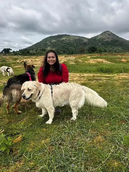 Here I am with a happy Golden Retriever and German Shepherd on one of our nature expeditions. I'm always present to guide the pack, ensuring every dog is safe, comfortable, and having the best time possible.