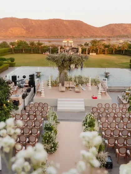 An elegant morning ceremony set against the serene lawns of Udaipur. The clean white and green palette, with a sculptural floral tree as the centerpiece, shows my dedication to creating sophisticated and architecturally inspired designs.