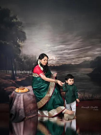 A mother's gentle guidance. This heartwarming shot captures the bond between a mother and her son against a painted, moonlit backdrop.