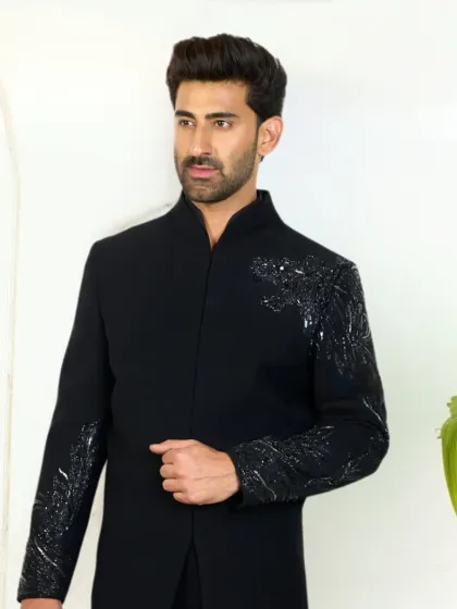 The black kurta with hand-embroidered cheetah detail, a symbol of grace and power. This piece blends tradition with modern elegance for unforgettable moments.