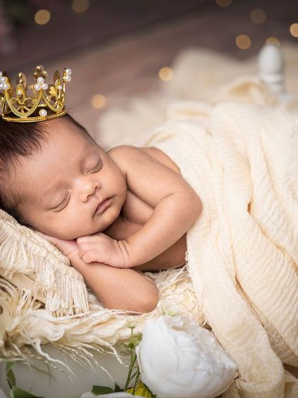 A duplicate of image 81, a serene and royal newborn portrait.