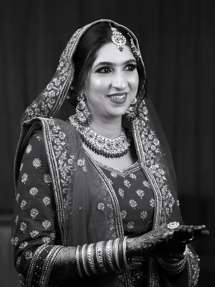 A timeless black and white portrait. This shot proves that great makeup stands the test of time, capturing the bride's happiness in a classic, elegant way.